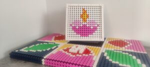 Picture of a Rangoli brickwork, along with a Pink candle brickwork.