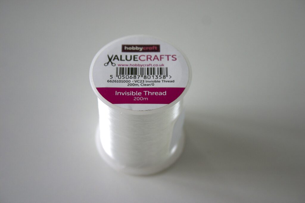 A spindle of hobbycraft branded invisible thread.